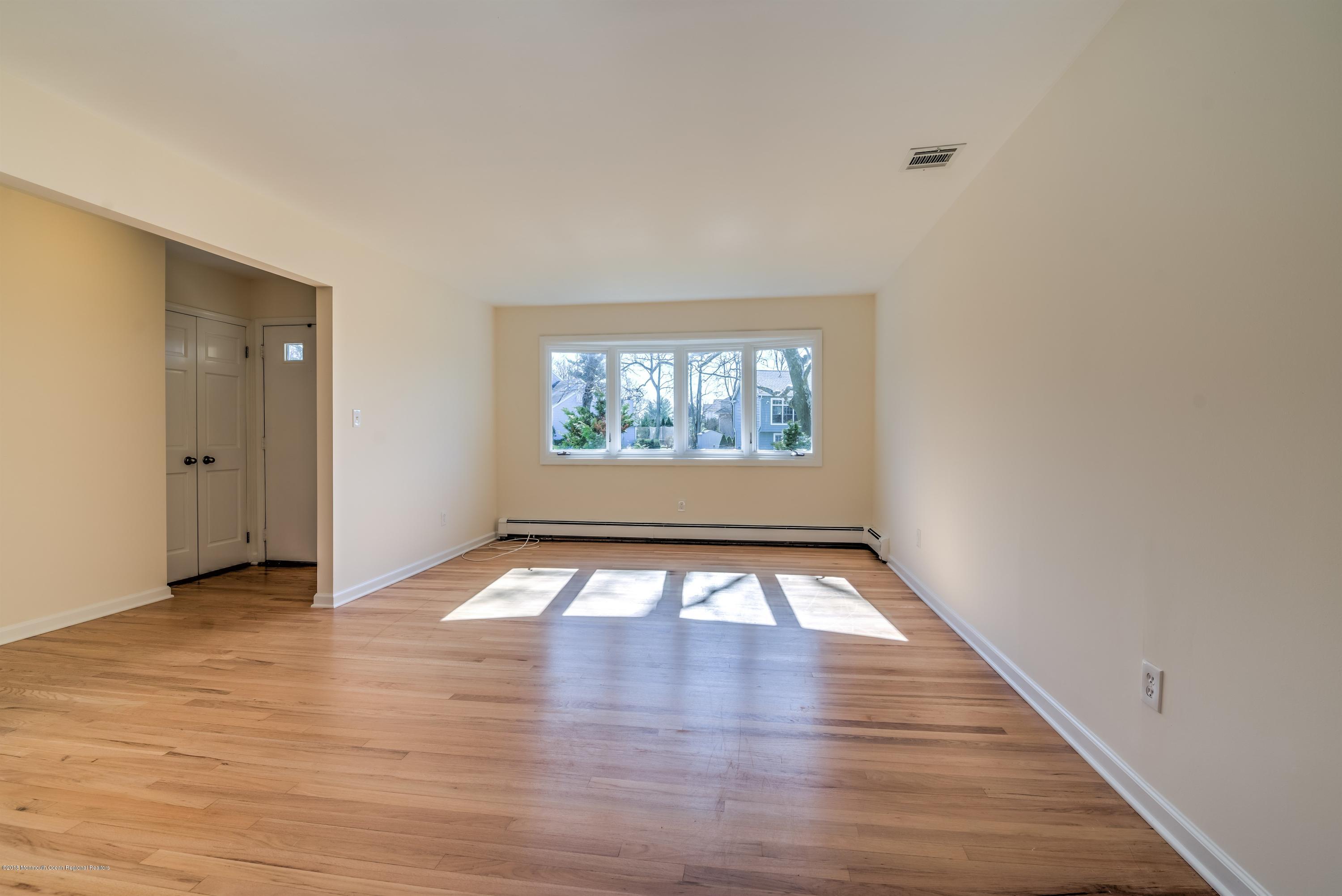 2 Ruddy Court Little Silver, NJ 07739 - Photo 3 of 19 wooden floor in an empty room with a window