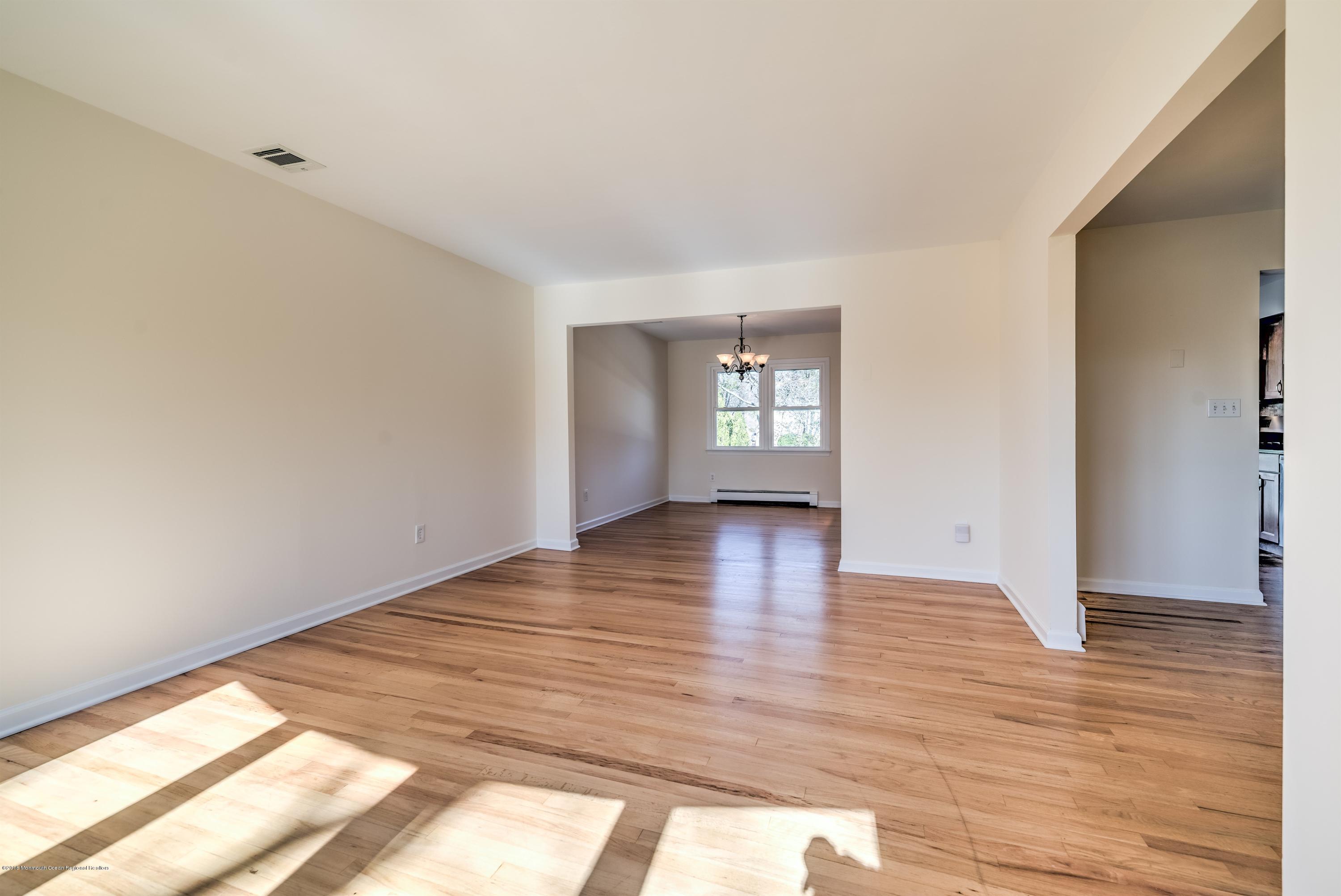 2 Ruddy Court Little Silver, NJ 07739 - Photo 4 of 19 a view of empty room with wooden floor and fan