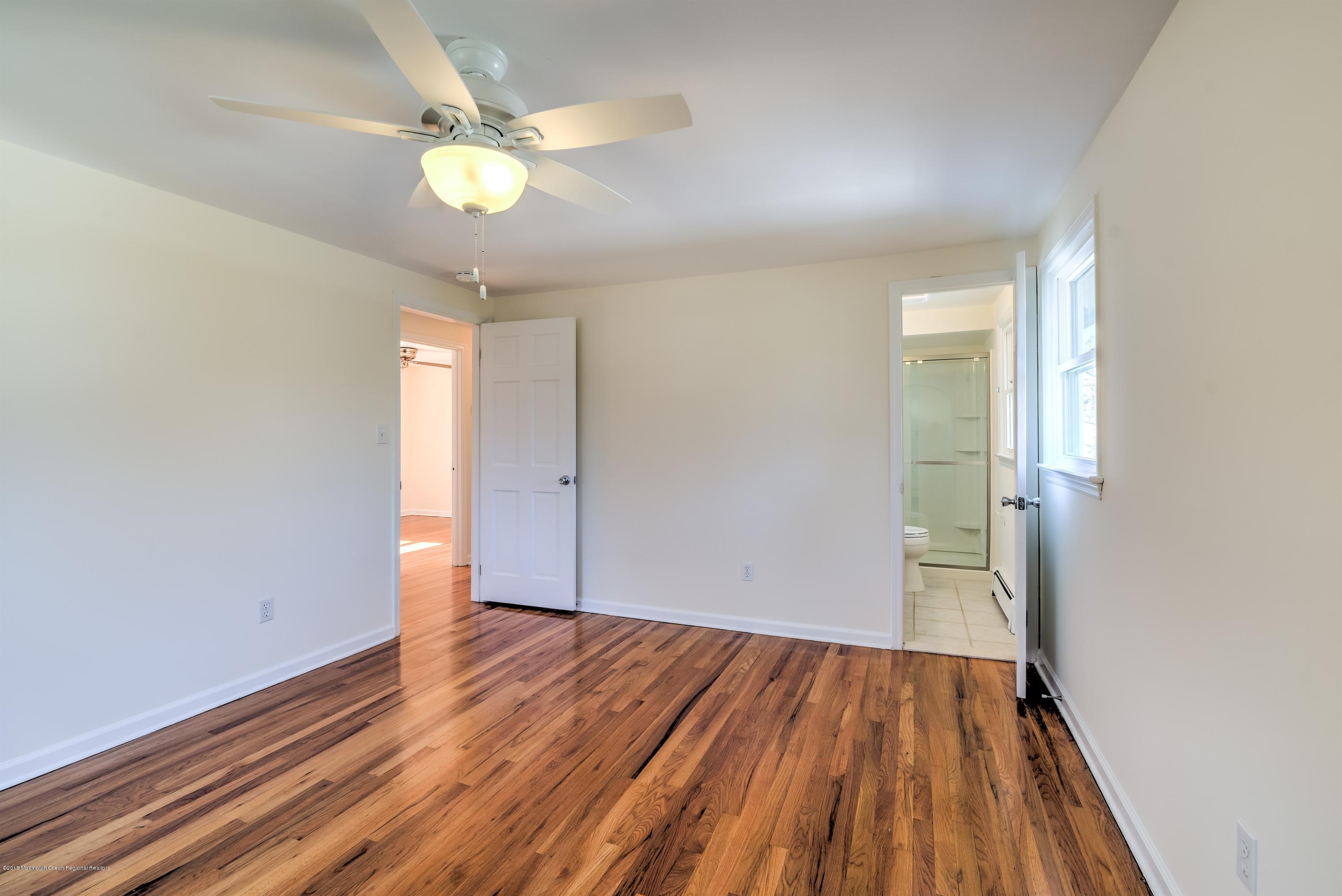 2 Ruddy Court Little Silver, NJ 07739 - Photo 10 of 19 wooden floor in an empty room with a window