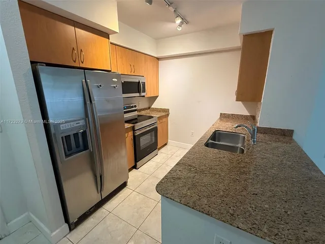 a view of a livingroom with wooden floor