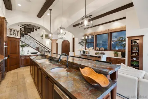 a kitchen with sink stove and cabinets