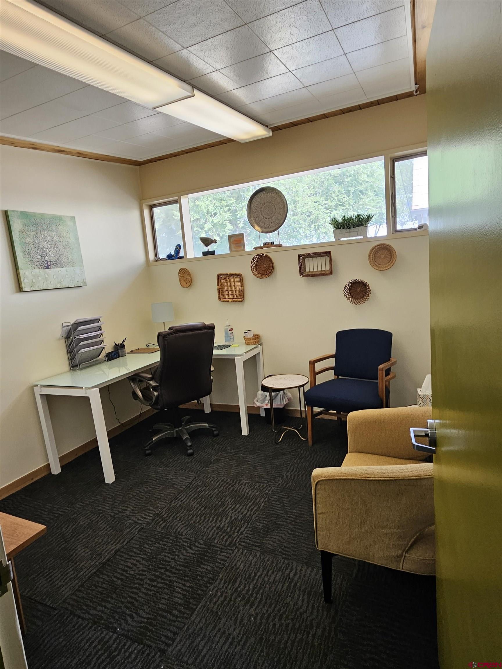 555 Meeker Street Delta, CO 81416 - Photo 14 of 19 a work room with furniture and a table