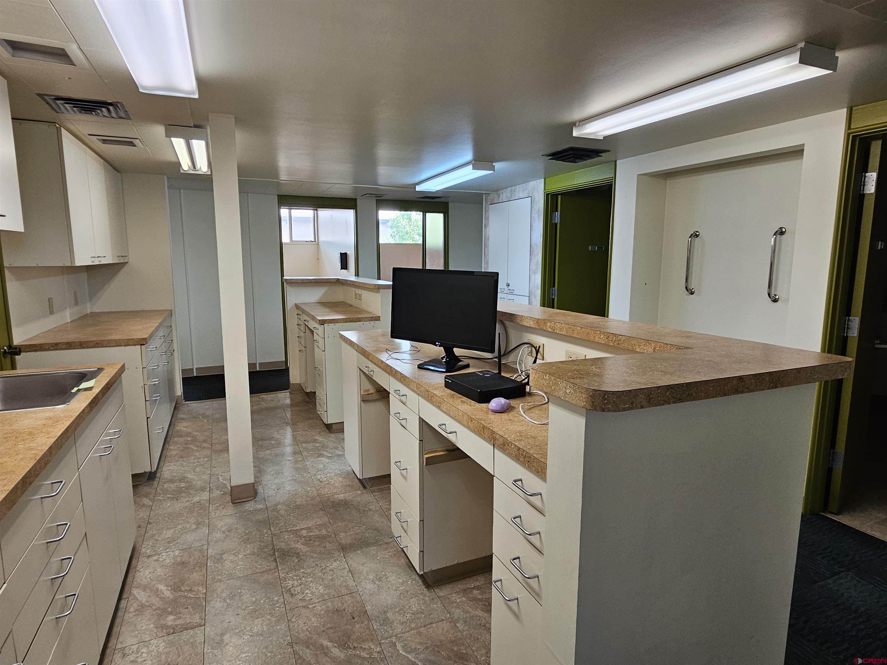 555 Meeker Street Delta, CO 81416 - Photo 18 of 19 a kitchen with appliances cabinets and a sink