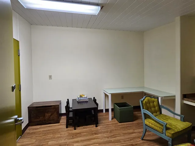 a view of a room with a wooden roof