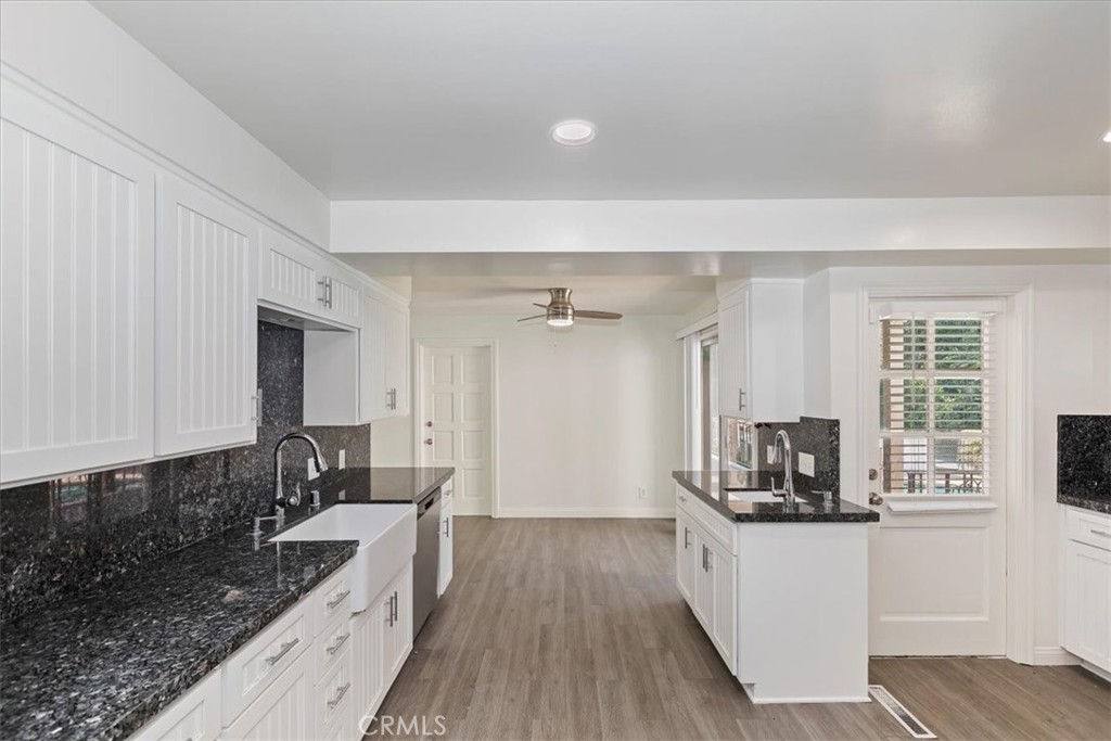 2154 Gainsborough Drive Riverside, CA 92506 - Photo 22 of 43 a kitchen with stainless steel appliances granite countertop a stove a sink and a refrigerator