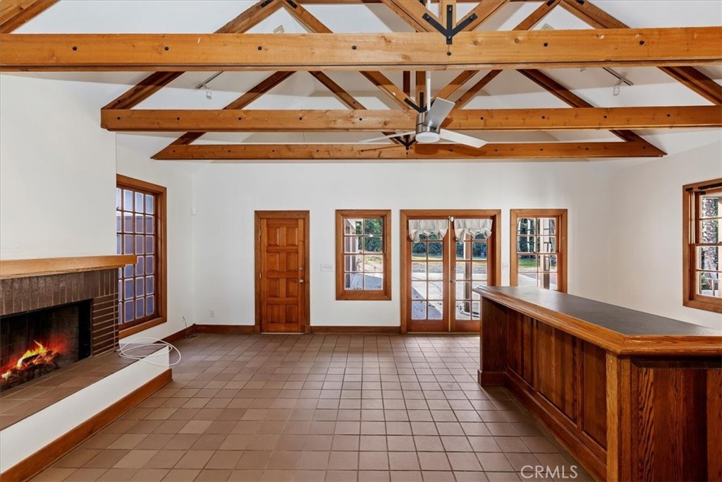 2154 Gainsborough Drive Riverside, CA 92506 - Photo 23 of 43 a view of a room with wooden floor and a fireplace