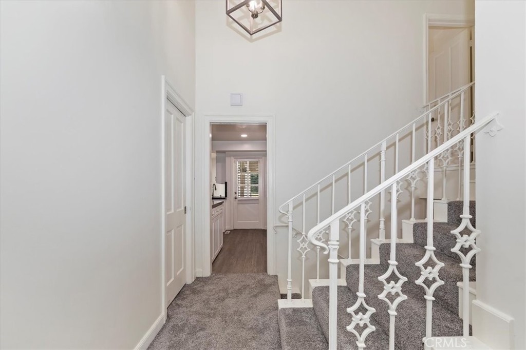 2154 Gainsborough Drive Riverside, CA 92506 - Photo 27 of 43 a view of a hallway with wooden floor and entryway