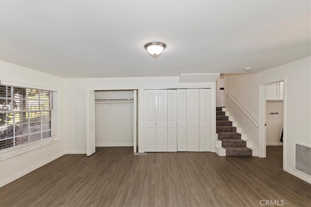 2154 Gainsborough Drive Riverside, CA 92506 - Photo 30 of 43 an empty room with wooden floor and windows