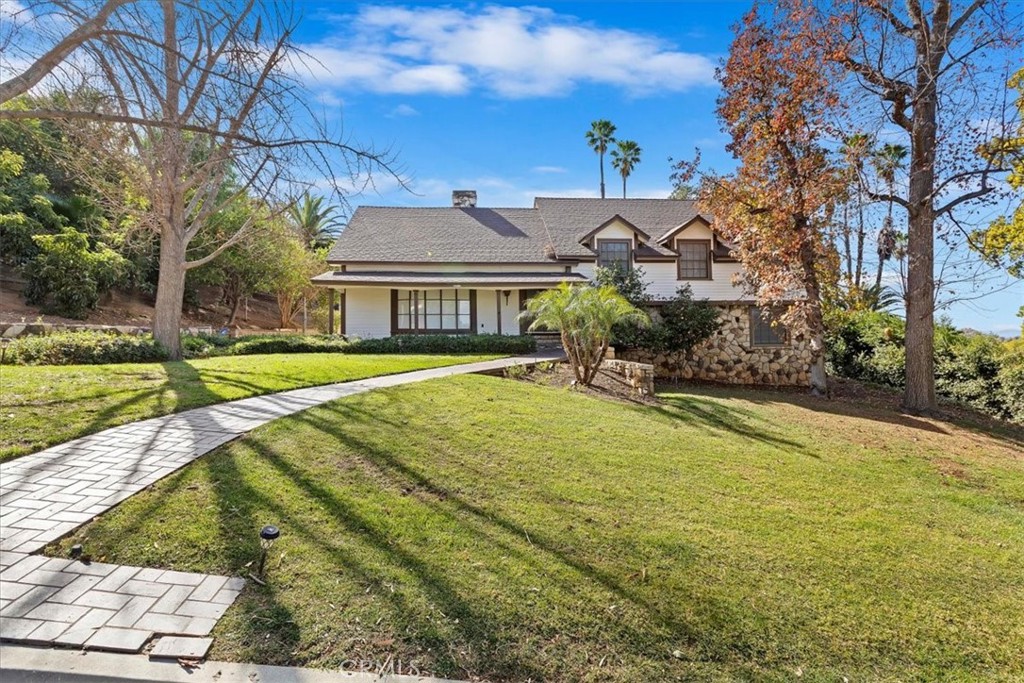 2154 Gainsborough Drive Riverside, CA 92506 - Photo 3 of 43 a view of a house with a yard and large trees