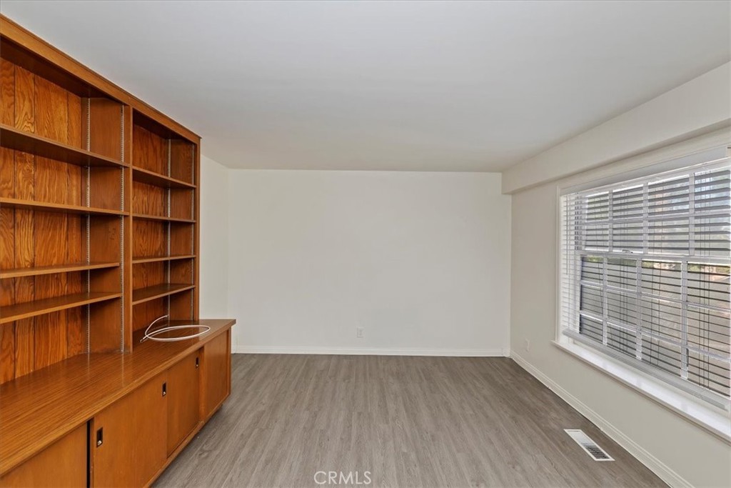 2154 Gainsborough Drive Riverside, CA 92506 - Photo 31 of 43 a view of walk in closet with empty racks