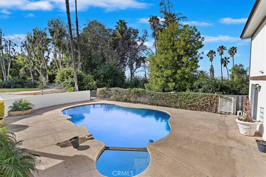 2154 Gainsborough Drive Riverside, CA 92506 - Photo 5 of 43 a view of a swimming pool with a patio