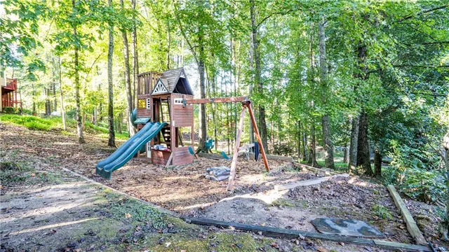 a view of a park with large trees