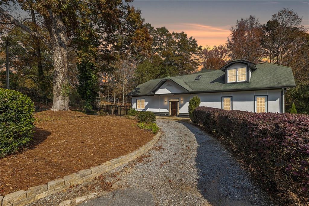 14440 Cogburn Road Alpharetta, GA 30004 - Photo 51 of 62 a front view of a house with a yard
