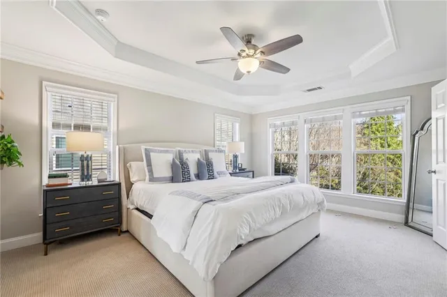 a bedroom with a bed dresser and a window