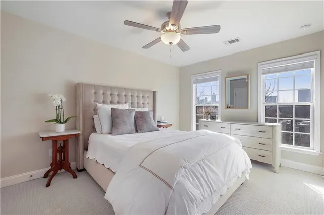 a bedroom with a bed and a desk