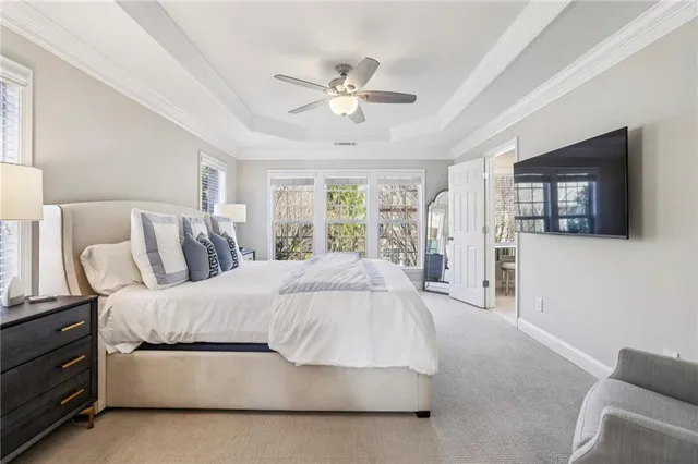 a spacious bedroom with a bed and window