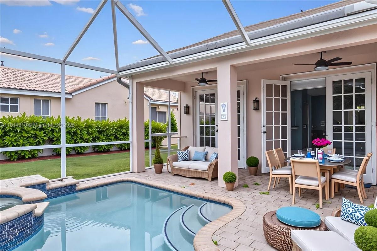 930 Briar Ridge Road Weston, FL 33327 - Photo 3 of 78 a swimming pool with outdoor seating and patio