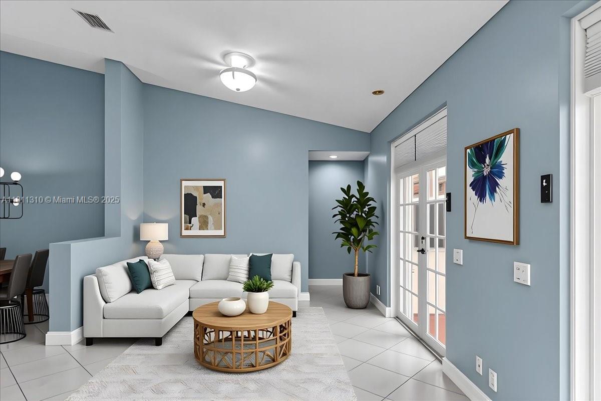 930 Briar Ridge Road Weston, FL 33327 - Photo 34 of 78 a living room with furniture and a chandelier