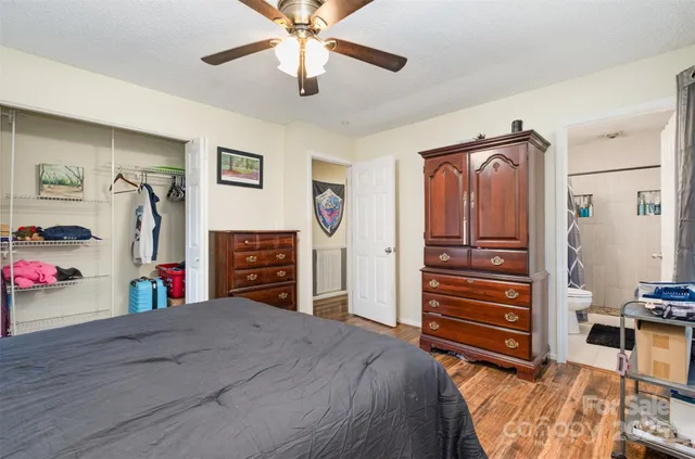 a bedroom with furniture and closet