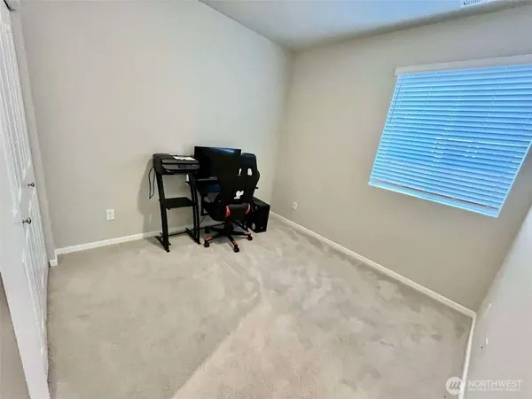 a view of a workspace with furniture