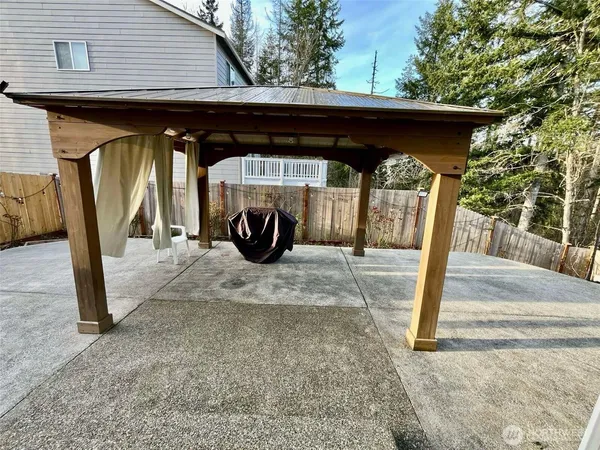 a bathroom with a sink vanity mirror and toilet