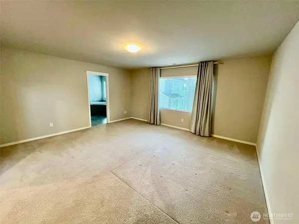 a view of parking garage with cars parked