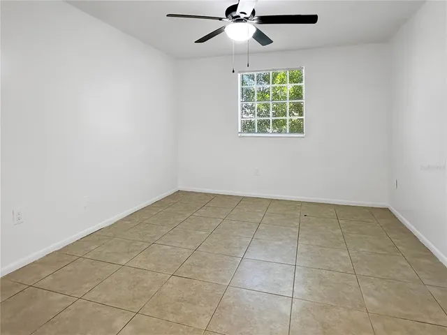a view of a swimming pool with outdoor seating and plants