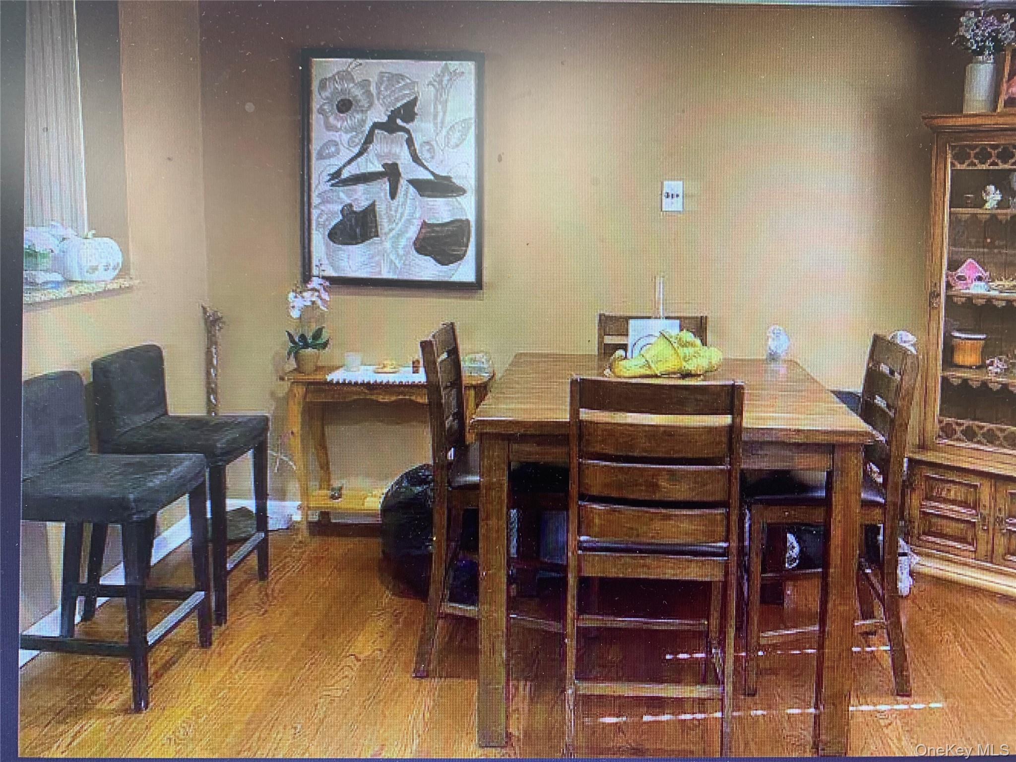 54 Robert Street Freeport, NY 11520 - Photo 2 of 11 a view of a dining room with furniture and a potted plant
