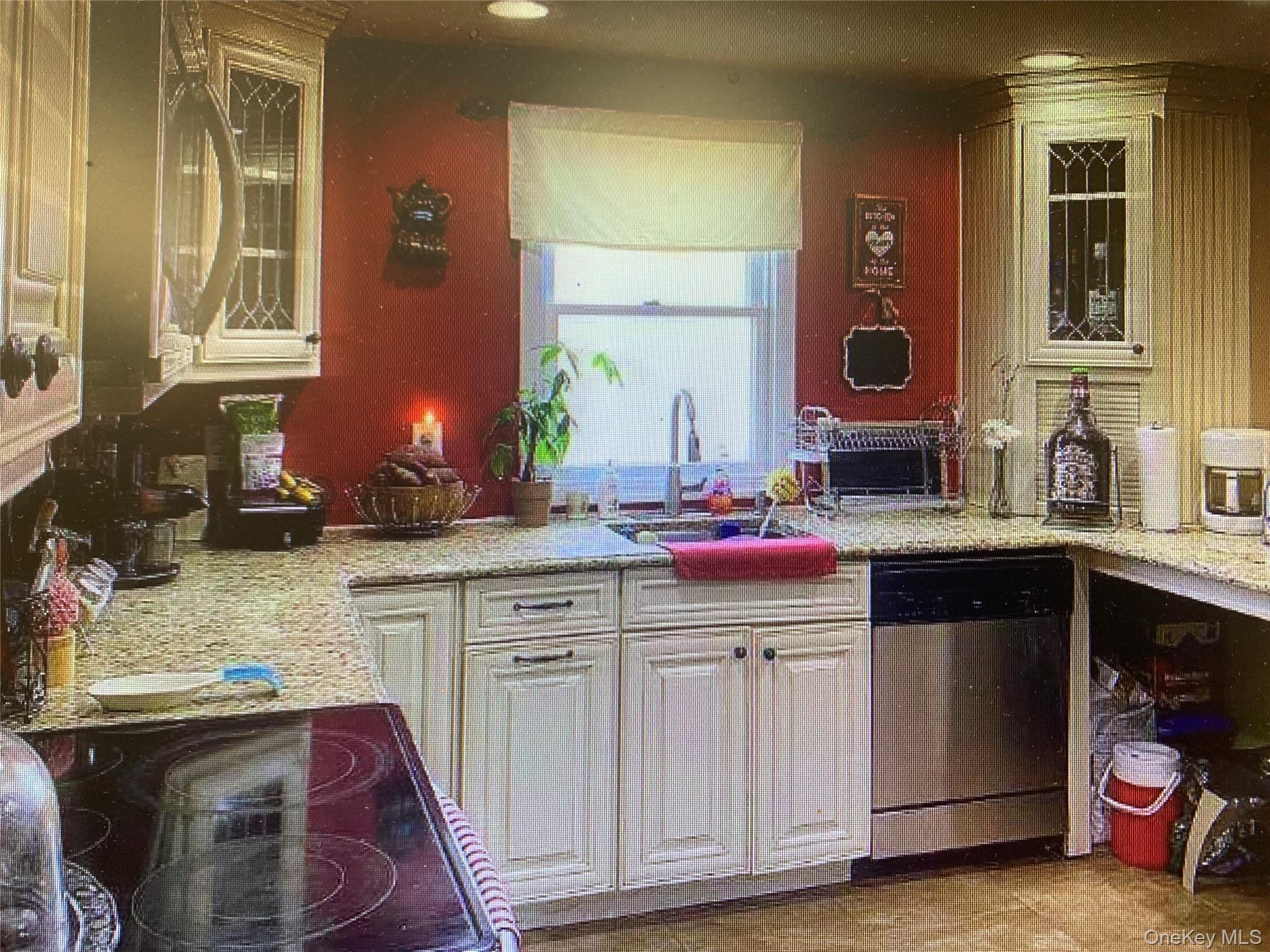 54 Robert Street Freeport, NY 11520 - Photo 4 of 11 a kitchen with white cabinets and sink