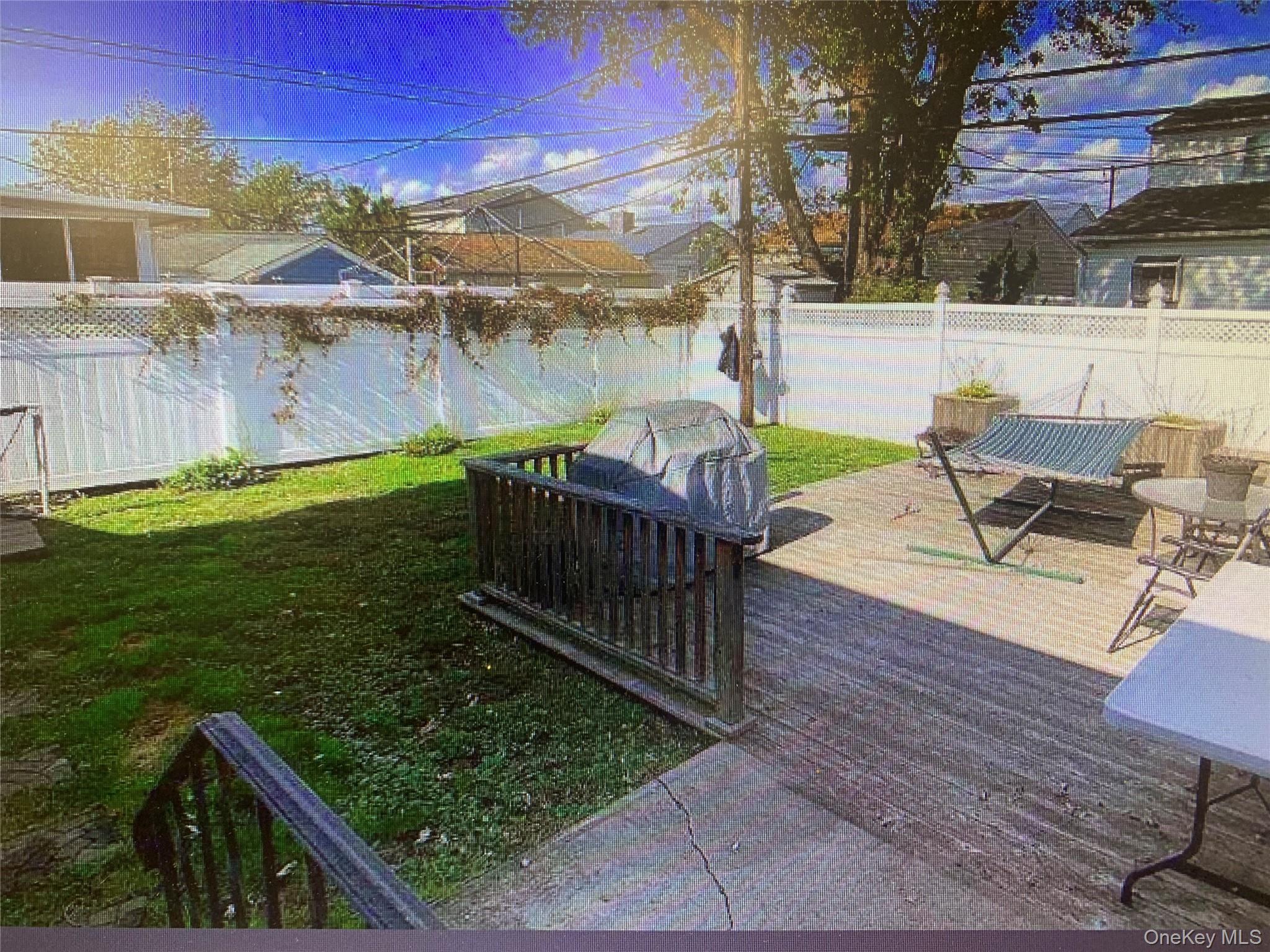 54 Robert Street Freeport, NY 11520 - Photo 9 of 11 a view of a chairs and table on the wooden floor