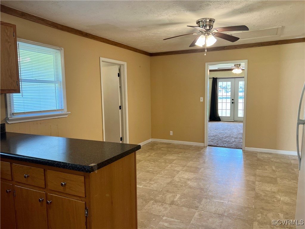 2733 Indian Oak Road Crewe, VA 23930 - Photo 12 of 31 a kitchen with granite countertop a stove a sink and a refrigerator