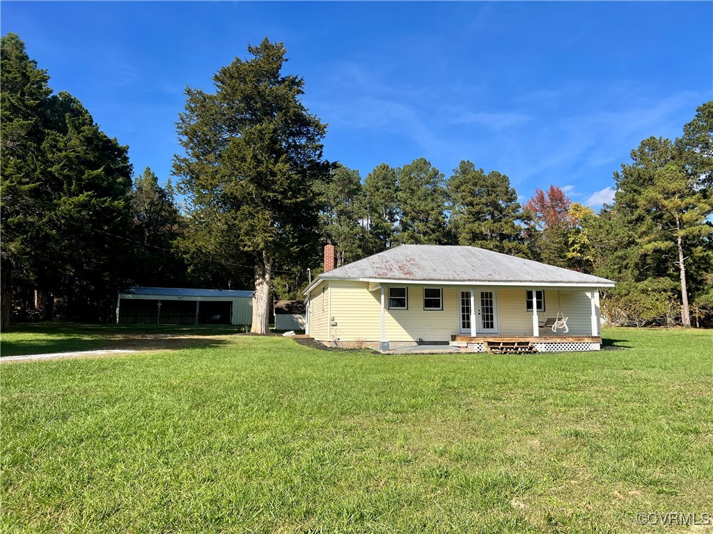 2733 Indian Oak Road Crewe, VA 23930 - Photo 2 of 31 a white house with a big yard and large trees