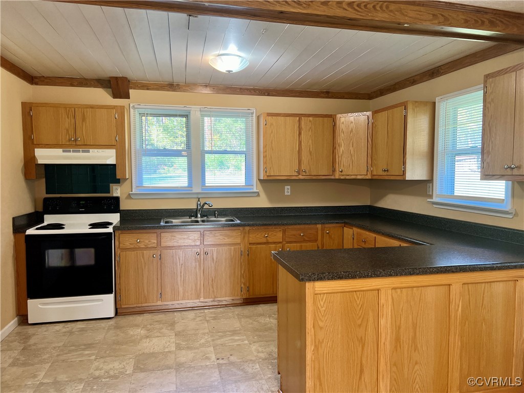 2733 Indian Oak Road Crewe, VA 23930 - Photo 10 of 31 a kitchen with stainless steel appliances granite countertop a stove a sink and a microwave