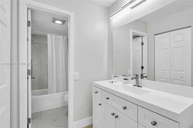 a bathroom with a shower and a shower
