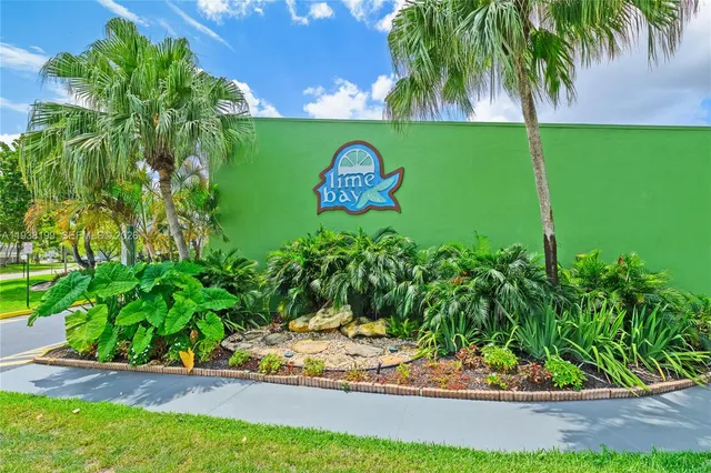 a view of a living room with furniture and kitchen view