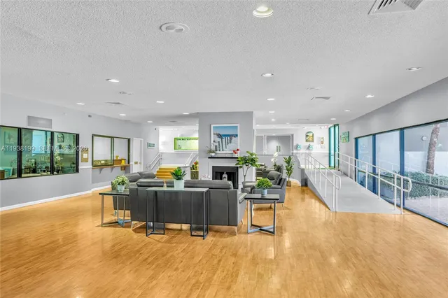 a living room with furniture and a pool table