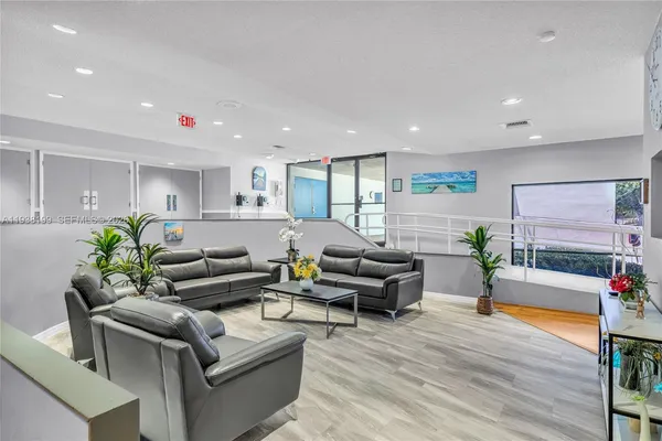 a dining room with furniture and a book shelf