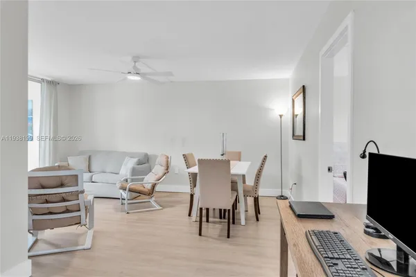 a work room with furniture and wooden floor