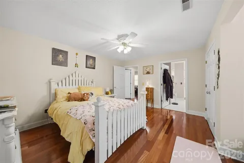 a bedroom with a bed and a walk in closet