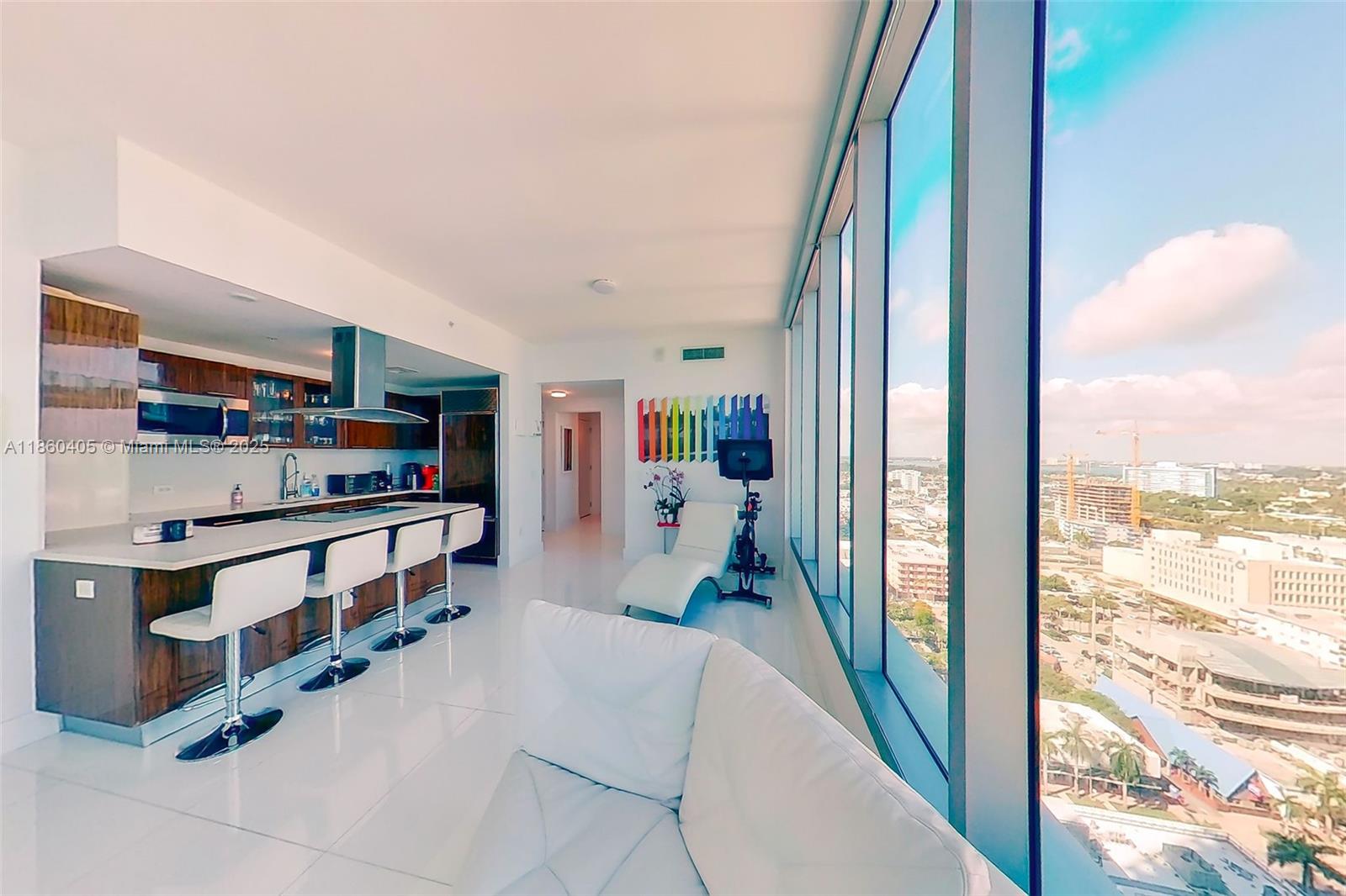 6899 Collins Avenue, Unit 1905 Miami Beach, FL 33141 - Photo 14 of 29 a view of a living room and a balcony