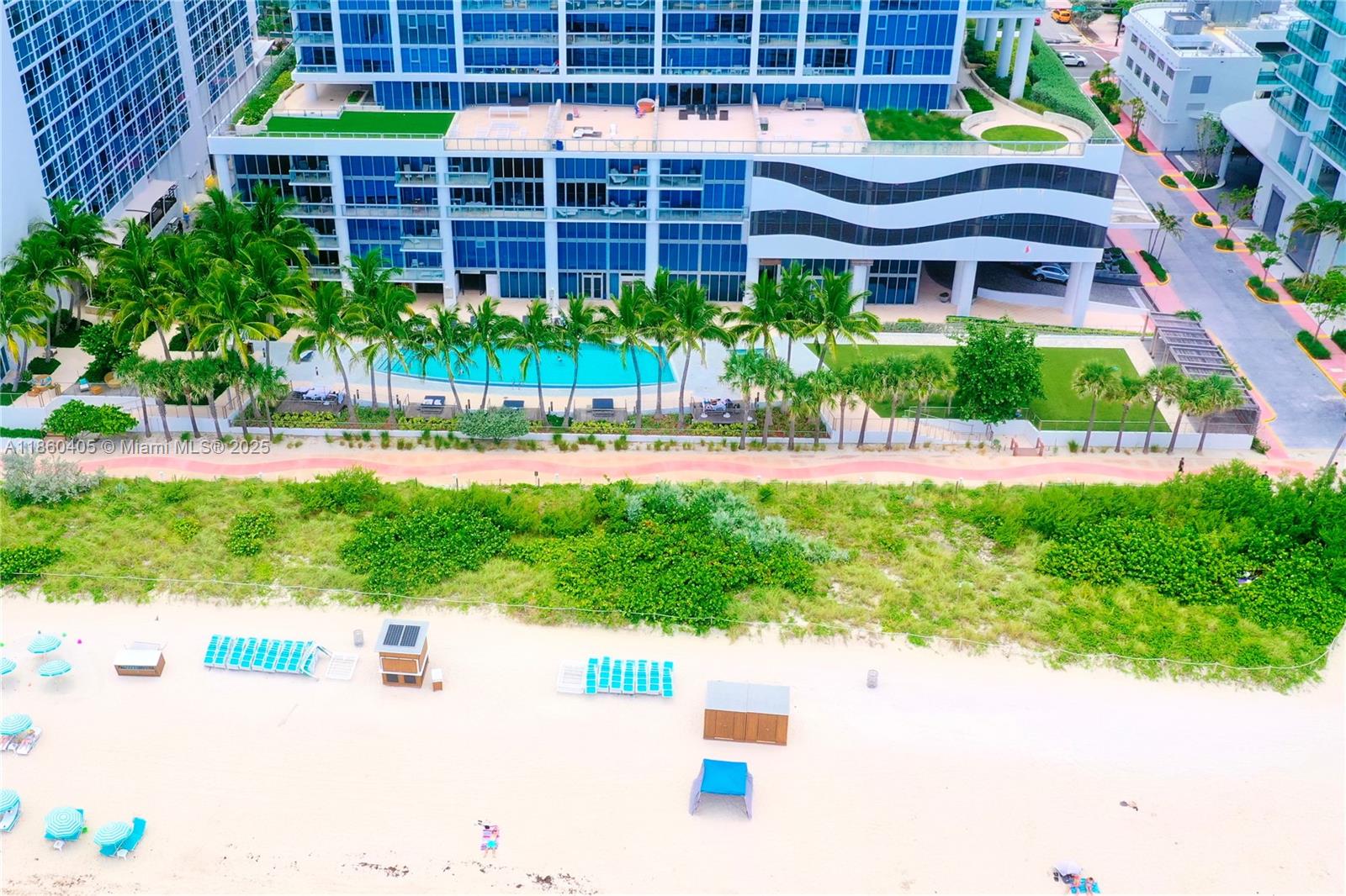 6899 Collins Avenue, Unit 1905 Miami Beach, FL 33141 - Photo 17 of 29 a view of a building with a garden and plants