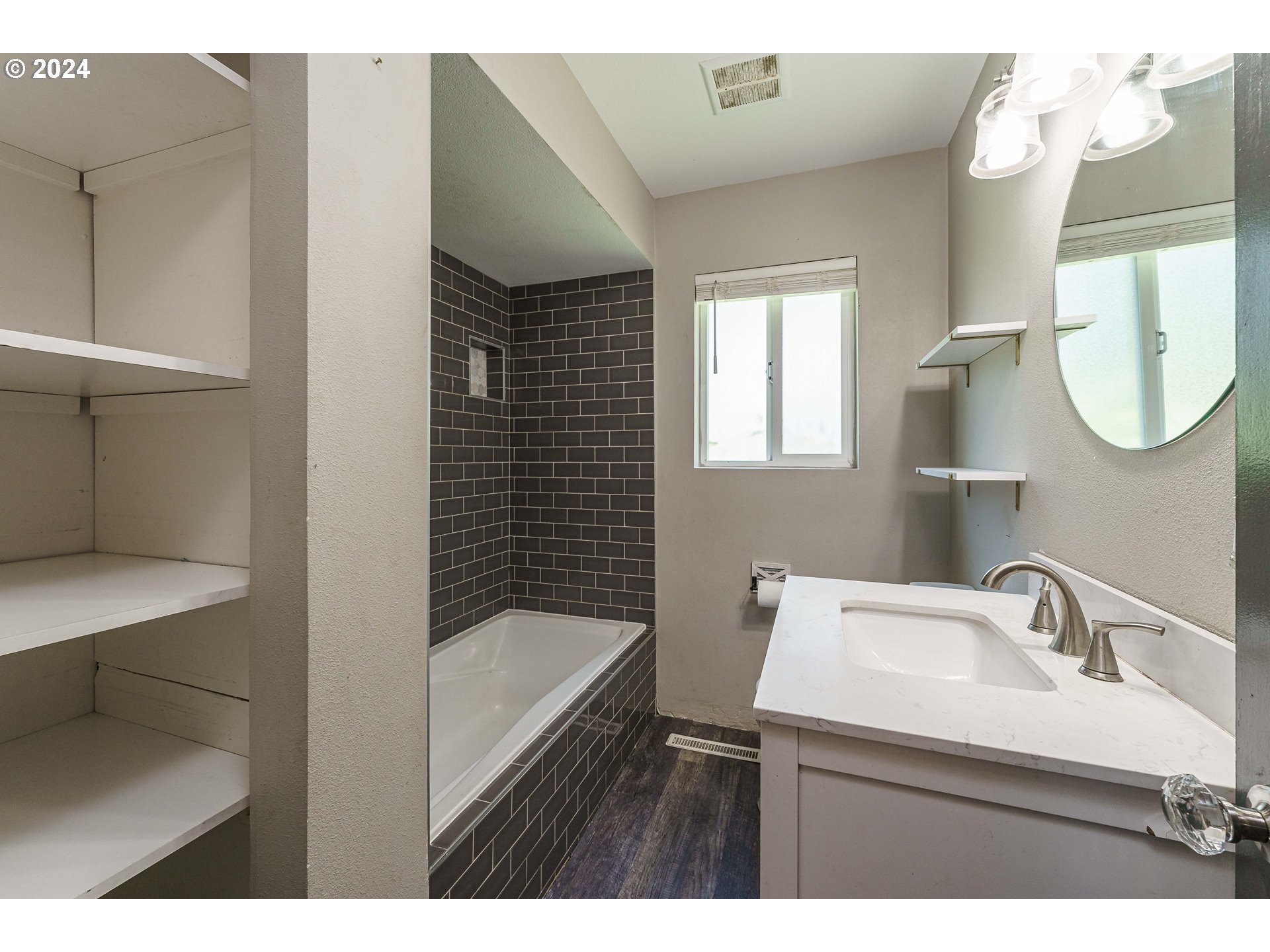 19625 Southeast Jacoby Road Sandy, OR 97055 - Photo 15 of 47 a bathroom with a bathtub sink and mirror