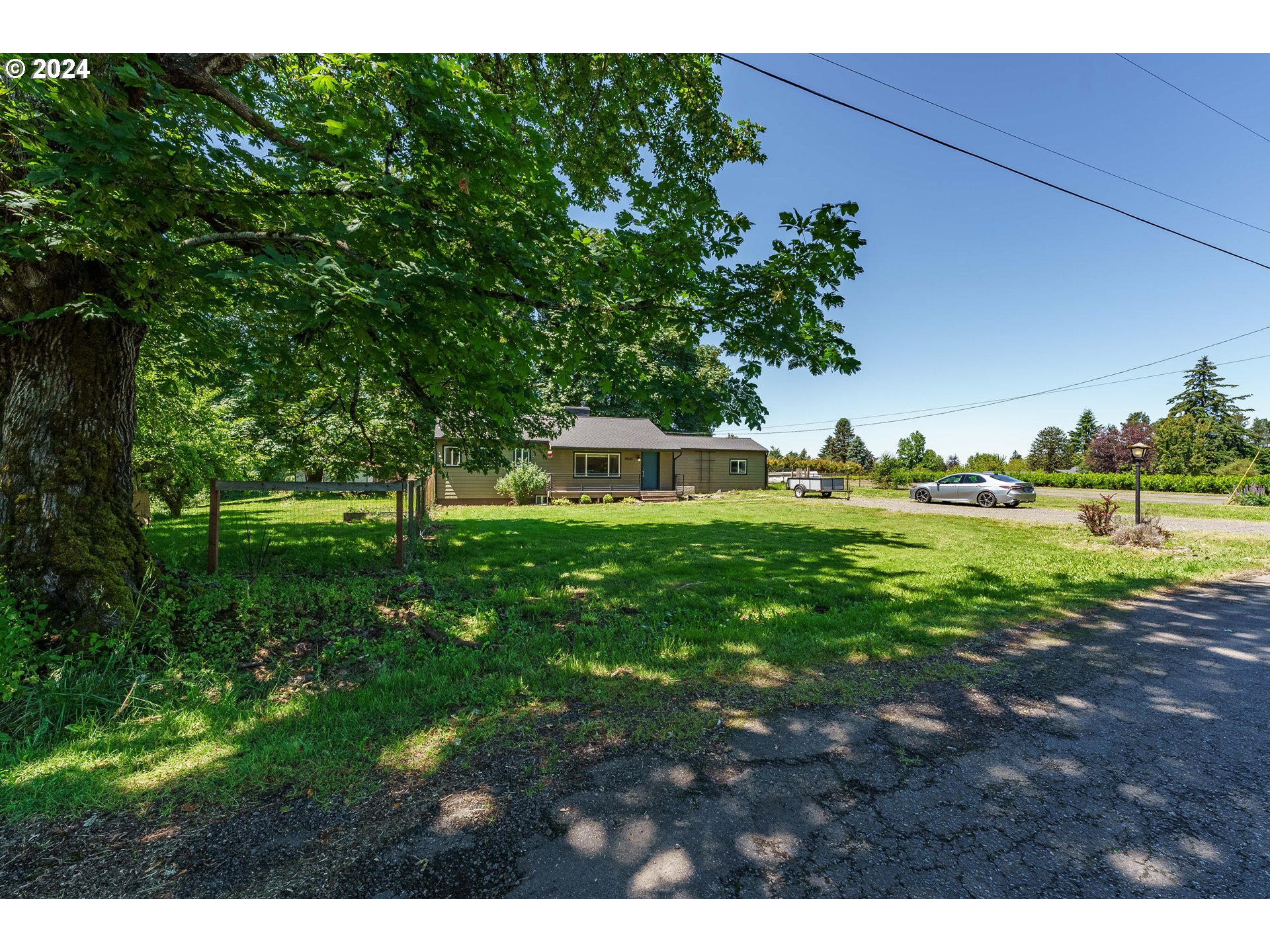 19625 Southeast Jacoby Road Sandy, OR 97055 - Photo 3 of 47 a green field with lots of trees