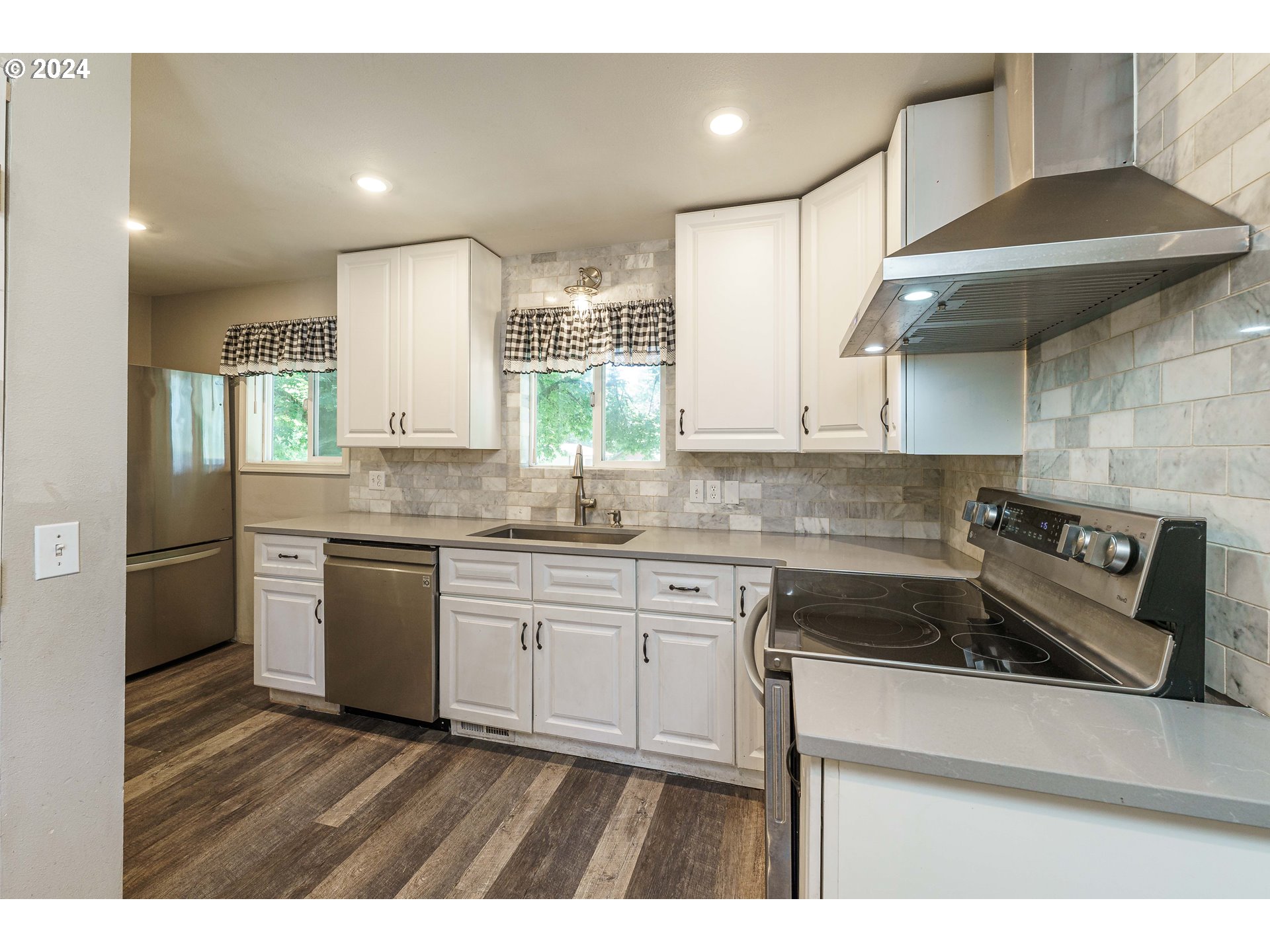 19625 Southeast Jacoby Road Sandy, OR 97055 - Photo 8 of 47 a kitchen with stainless steel appliances granite countertop a sink a stove a refrigerator and island