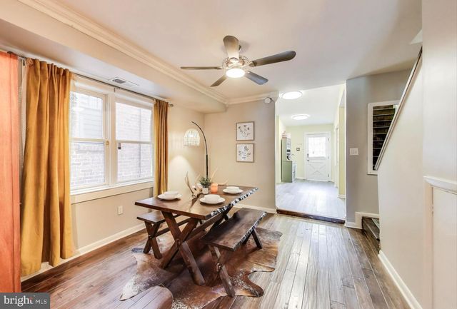 a workspace with wooden floor and a window