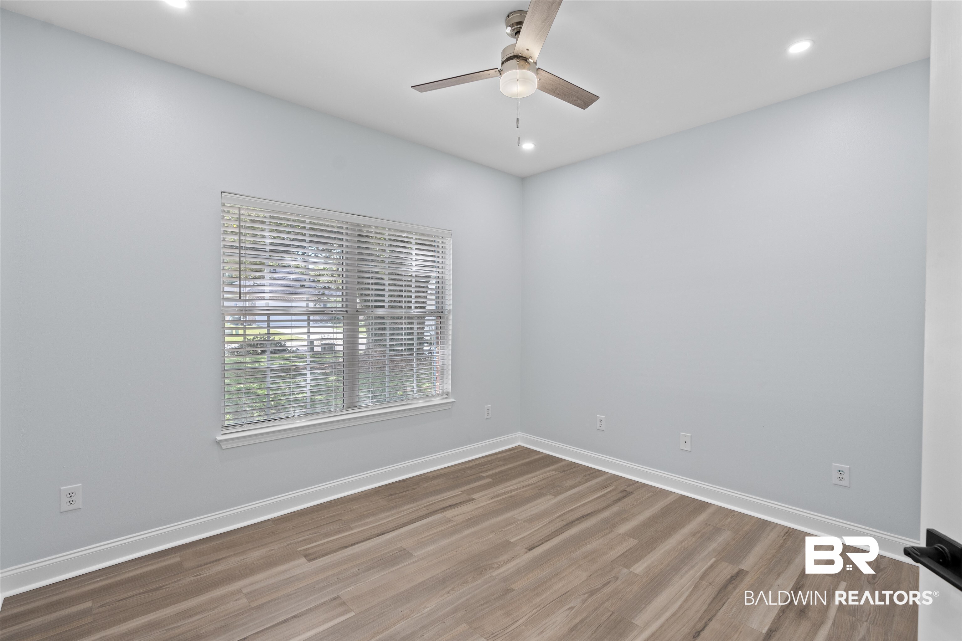 14947 Silveroaks Loop Silverhill, AL 36576 - Photo 14 of 24 Unfurnished room with wood finished floors, recessed lighting, and ceiling fan