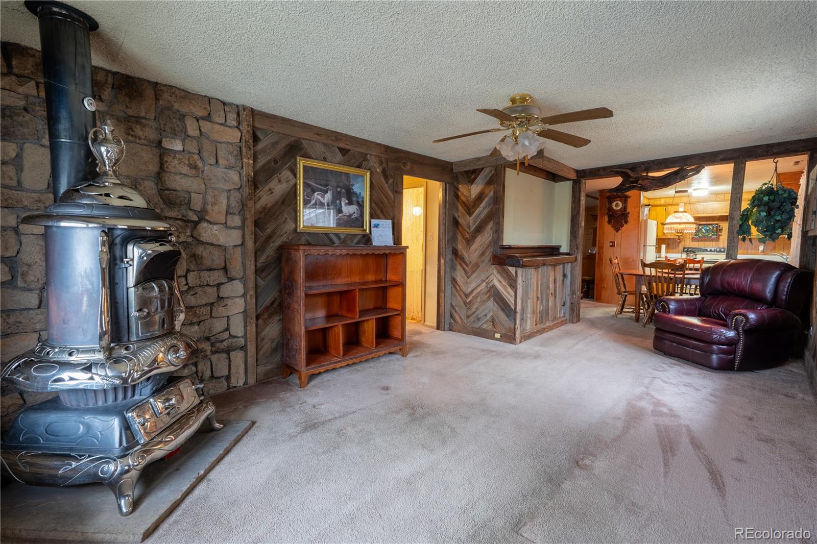 12169 East Baseline Road Lafayette, CO 80026 - Photo 5 of 39 a living room with furniture and a fireplace
