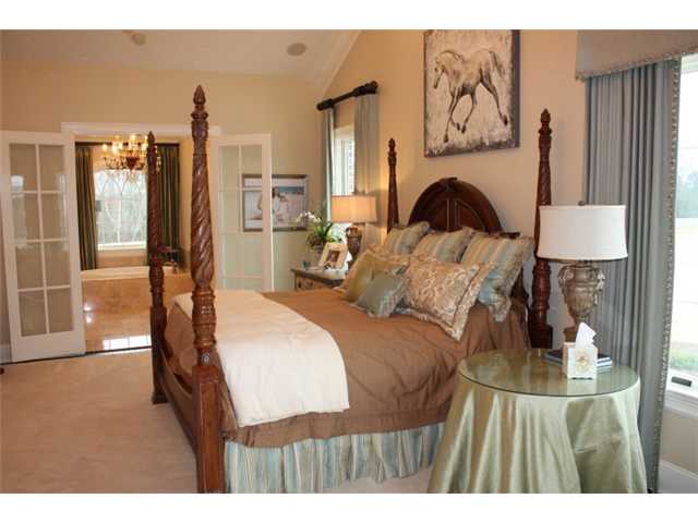 288 Irvin Road Stantonville, TN 38379 - Photo 12 of 25 Master Downstairs with Private Spa Bath - Oversized Dressing Closet with Island and Builtin Storage -A Private Laundry In Master Closet
