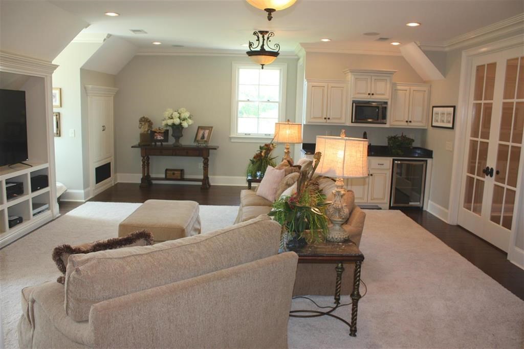 288 Irvin Road Stantonville, TN 38379 - Photo 15 of 25 Upstairs Bonus / Family Room with Custom Cabinetry/ Wet Bar / Additional Play Room and/ or Bedroom with French Entry adjacent to this Bonus Room