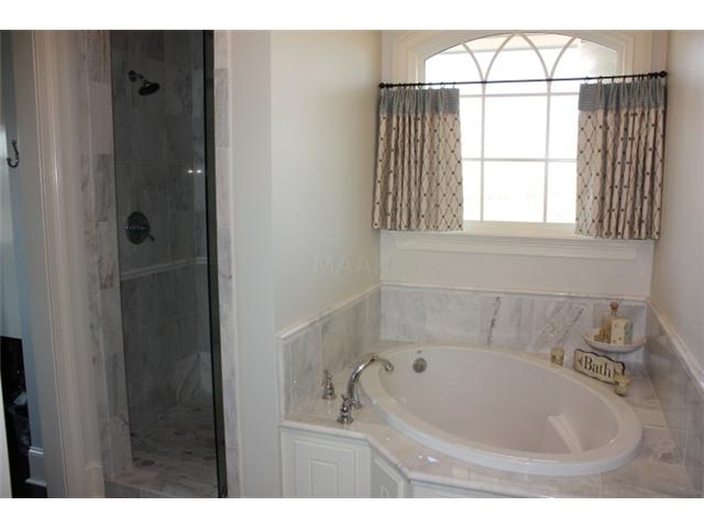 288 Irvin Road Stantonville, TN 38379 - Photo 18 of 25 Marble Surround Garden tub with Marble Shower Upstairs Master Bath- Each Upstairs suite has Private Bath-Custom Dressing Closets